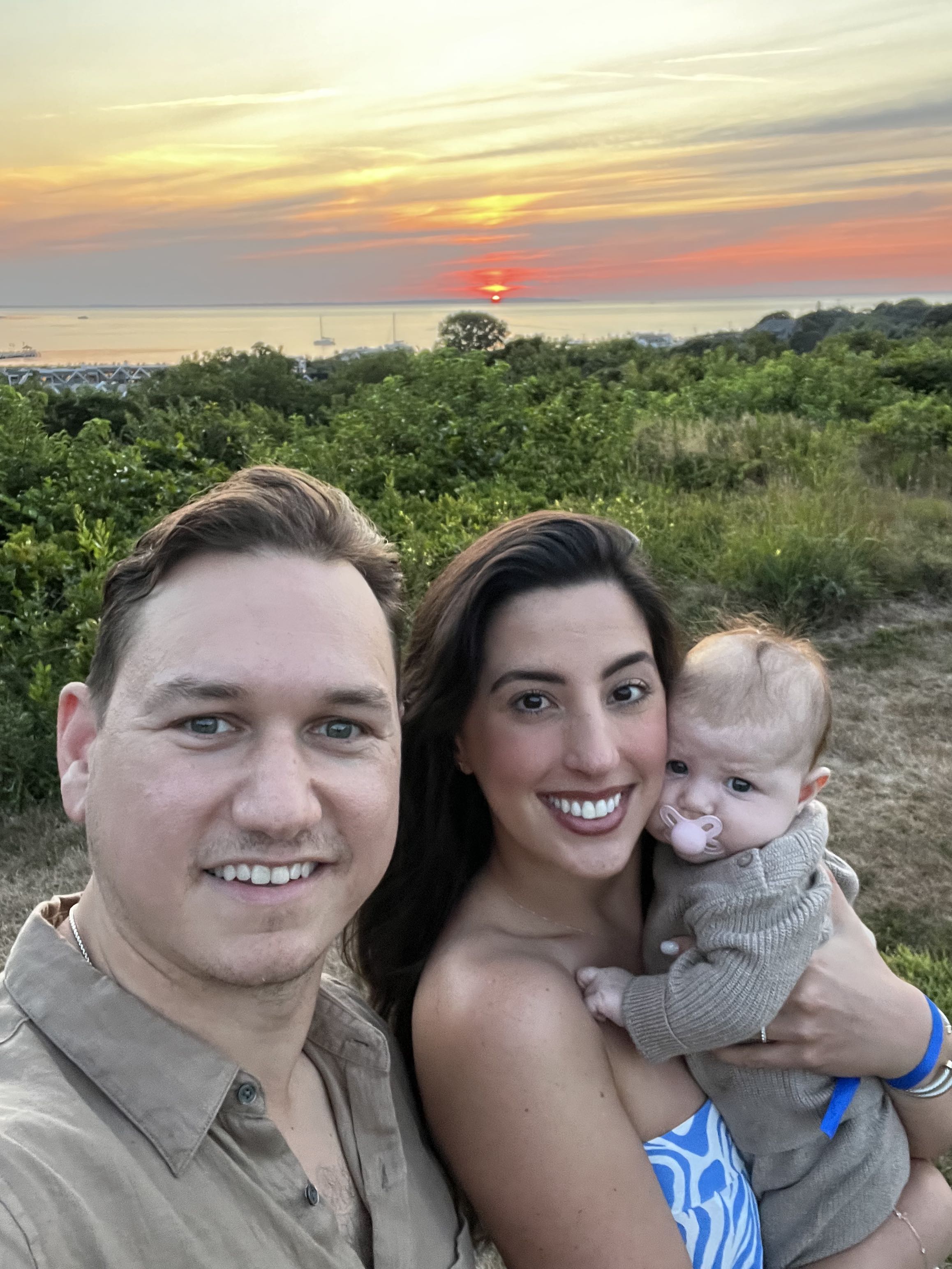 Anthony Perpepaj with his wife Valentina and baby